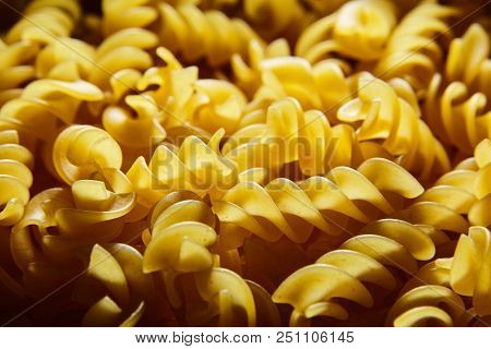 Raw Uncooked Dry Italian Fusilli Pasta. Corkscrew Spiral Shape