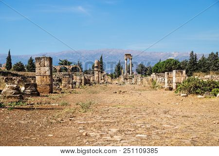 Remains Of Street In Umayyad City Ruins In Anjar With Mountains, Bekaa Valley, Lebanon