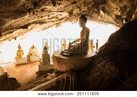 Hpa-an, Myanmar: January 10 2013: Sitting Golden Buddha Statues Yathaypyan Temple Cave
