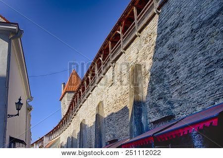 Travel Ideas. Ancient Wall Of Renowned Tallinn Landmark Viru Gates In Estonia. Famous And Popular To