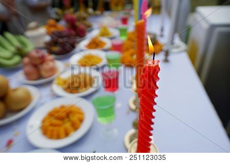 Close Up Of Candlelight At Altar On Blurred Table, Religion Concept