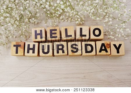 Hello Thursday Alphabet Letters On Wooden Background