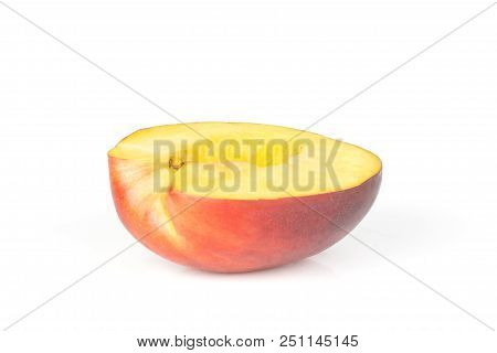 One Half Of Ripe Deep Red Nectarine Isolated On White
