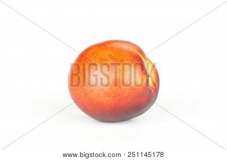 One Whole Ripe Deep Red Nectarine Isolated On White
