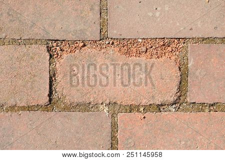 Broken Tile In The Pavement