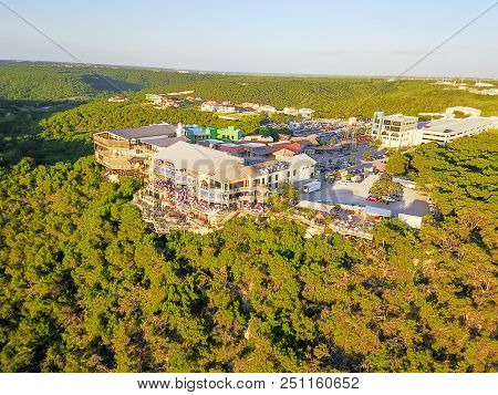 Aerial Colorful Restaurant And Vacation Homes In Lush Green Forest