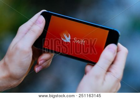 Berlin, Germany - July 26, 2018: Closeup Of Smartphone Screen With Apple Swift Logo And Icon
