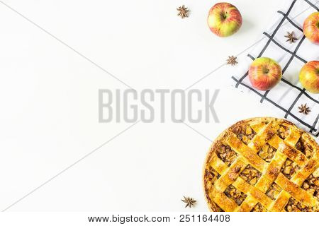 Traditional American Apple Pie With Dough Decoration In A Grid On A White Table. Autumn Baking Conce