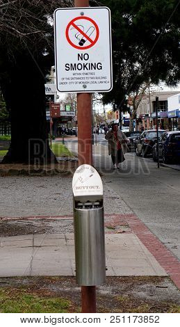 Oakleigh, Vic / Australia - Jul 26 2018: No Smoking Sign On Street With Stainless Steel Cigarette Bi