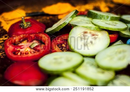Close Up Ingredeints Of Ayurvdic Face Pack Of Vegetables I.e. Sliced Cucumber,tomato Puree,and Turme