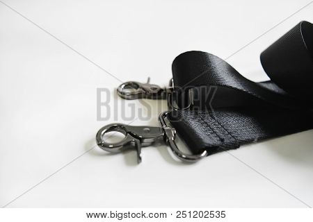 Bag Hook And Black Belt Rope Strap Lanyard 
White Background And Empty Space For Text.