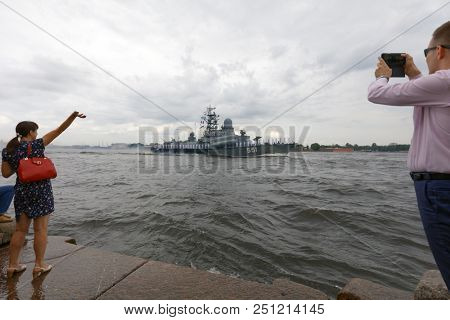 ST. PETERSBURG, RUSSIA - JULY 26, 2018: People make photo of the rehearsal of the Navy Day parade with Nanuchka class corvette Liven. Navy Day is celebrated in last Sunday of July