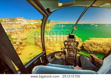 Helicopter Cockpit Interior Flying On Praia Da Rainha, Small Beach With Cliffs In Cascais Town, Port