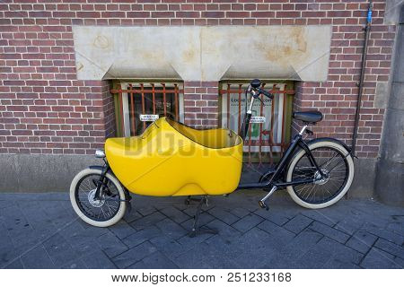 Amsterdam, Netherlands - July 02, 2018: Bicycle With A Baby Stroller In The Form Of Dutch Shoes Klom
