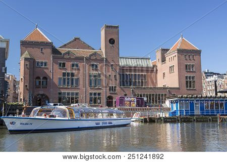Amsterdam, Netherlands - July 02, 2018: View Of The Berlage Exchange Building On Damrak Street In Th