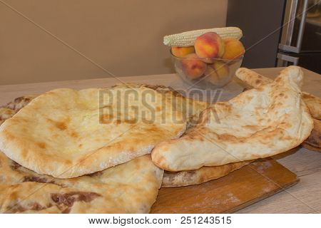 Traditional Georgian Cuisine - Bean Filled Bread (lobiani) On Wooden Table, Traditional Flatbread. F