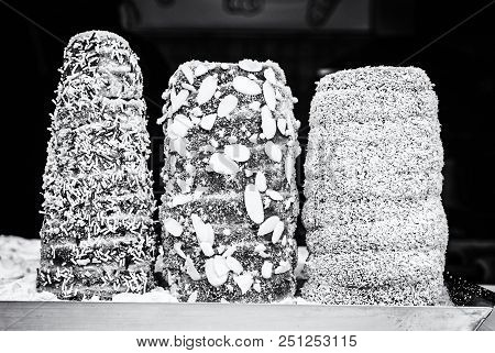 Trdelnik Is A Kind Of Spit Cake. It Is Made From Rolled Dough That Is Wrapped Around A Stick, Then G