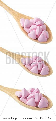 Healthcare Concept, Wooden Spoons Full With Vitamins Pills Isolated On White Background.