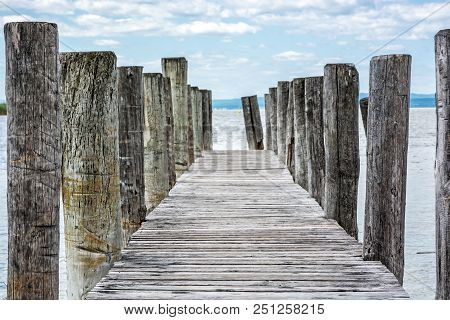 Wooden Pier In Podersdorf Am See, Lake Neusiedler See, Burgenland, Austria. Travelling Theme.