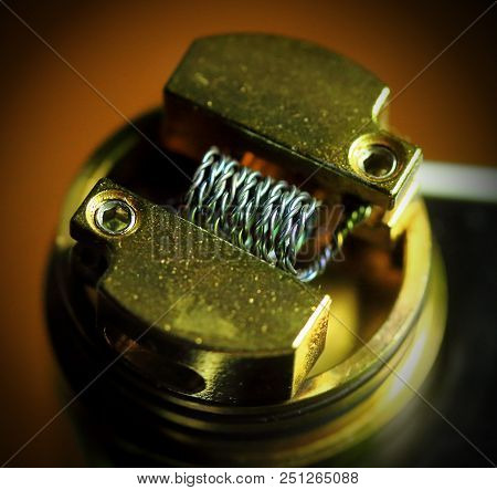 Nichrome Coil, Nichrome Wire Vape On A Dripper Gold. Vaporizer E-cig, E-cigarettes.