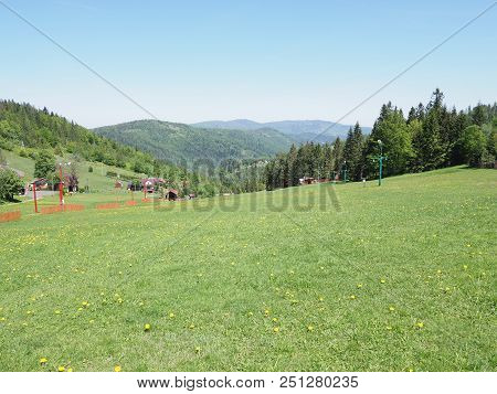 Desolate Green Grassy Field And Forest At Beskid Mountains Range Landscapes In European Salmopol Pas