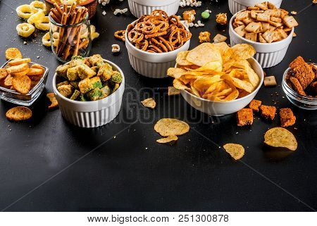 Variation Different Unhealthy Snacks Crackers, Sweet Salted Popcorn, Tortillas, Nuts, Straws, Bretse