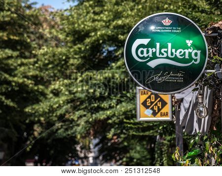 Belgrade, Serbia - July 11, 2018: Logo Of Carlsberg On A Bar Sign With Its Distinctive Visual. Carls
