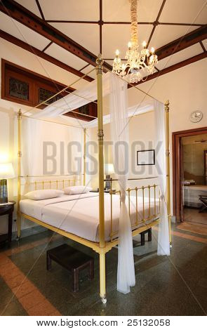 camera da letto tradizionale in un hotel in Indonesia