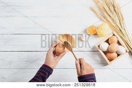 Breaking Boiled Egg With Wood Spoon Drop In Wood Bowl