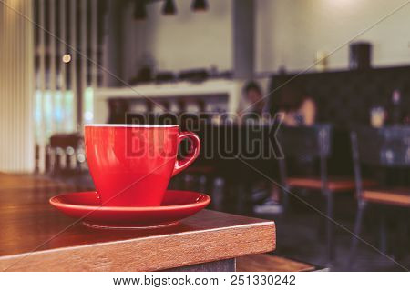 Red Coffee Cup In Cafe, On Morning
