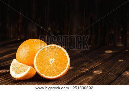 Mandarin Oranges Group On Wood Black Ground