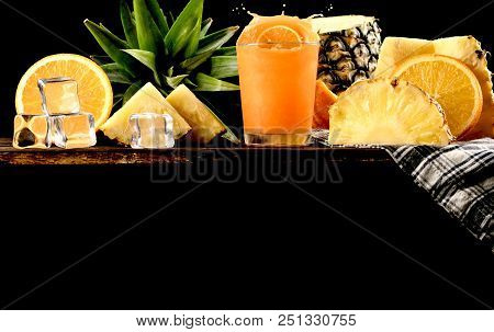 Splash Orange Juice And Pineapple Background, Copy Space