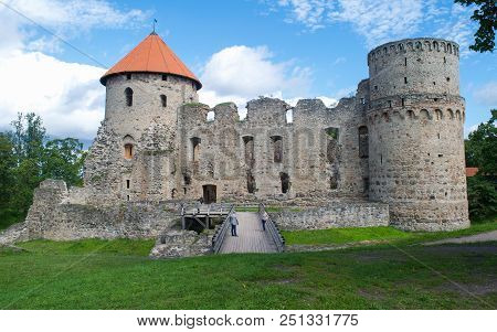 Cesis, Latvia - 9 August 2016: Unidentified People Standing On The Bridge To Cesis Medieval Castle