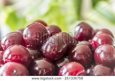 Cooking Cherry Jam.wet  Deep Red сherries On A Background Of Green Leaves . Site About Fruits, Berri