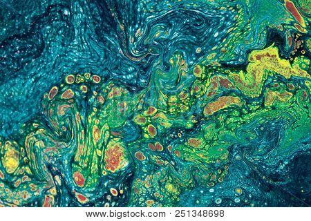 Marbling Textured Creative Background. Mixing Green, Blue And Yellow Paints. Lines And Bubbles.  Liq