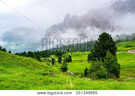 Beautiful Landscape Of The Green Valley  At Sella Pass In South Tyrol Italy With Italian House, The 