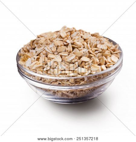 Oatmeal For Breakfast. Oatflakes In Glass Bowl, Isolated On White Background