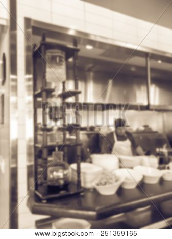 Vintage Blurred Background Chef Preparing For Lunch Service In Asian Restaurant Kitchen