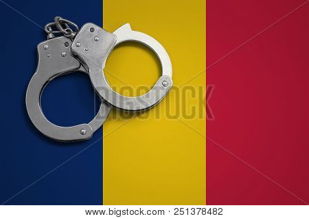 Chad Flag  And Police Handcuffs. The Concept Of Crime And Offenses In The Country.