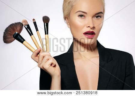 Beauty Treatment. Girl With Makeup Brushes. Fashion Make-up For Sexy Woman. Makeover. Make-up Artist