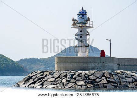 Geoje,south Korea - April 28, 2018: Gujora Hang South Breakwater, A Round White Metal Lighthouse Dec
