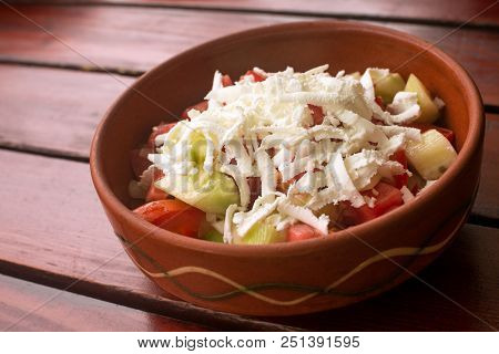 Tradidional Serbian Salad From Tomato, Cucumber, Onion And White Cheese.