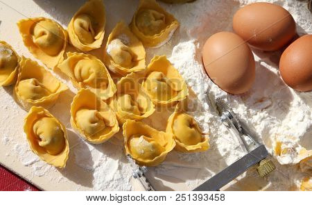 Background With Homemade Tortellini With Eggs And White Flour