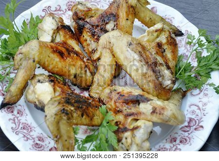 Apetitic Fried Chicken Cranberries In A Plate On A Dark Wooden Table