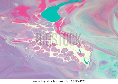 Abstraction Of The Flowing Multi-colored Acrylic Paints