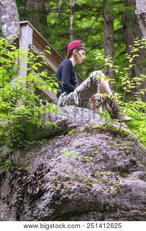 Franconia Notch State Park, New Hampshire, Usa - July 10, 2008: Hiker Meditating On Hillside In Fanc