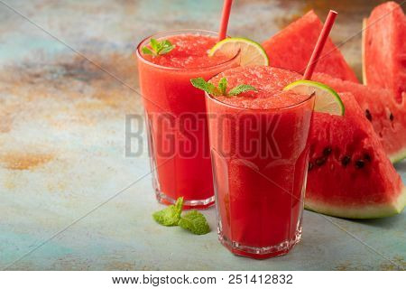 Watermelon Slushie With Lime, Summer Refreshing Drink In Tall Glasses On A Blue Rusty Background. Wi