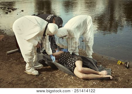Woman Found Drowned On River Bank In City Placed In Body Bag For Transportration