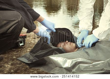 Woman Found Drowned On River Bank In City Placed In Body Bag For Transportration