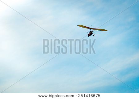 Glider High In The Sky. Glider On A Blue Sky Background.
